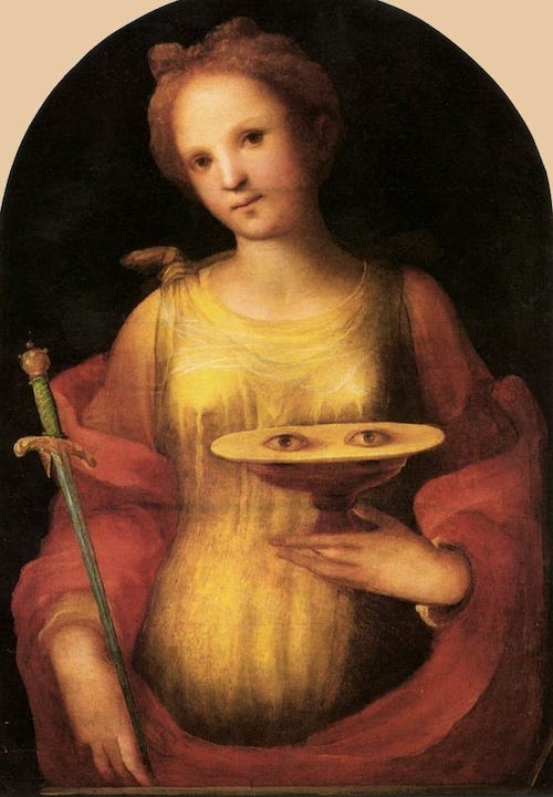 Saint Lucy holding a plate with two eyes on it. Saint Lucy holding a plate with two eyes on it.