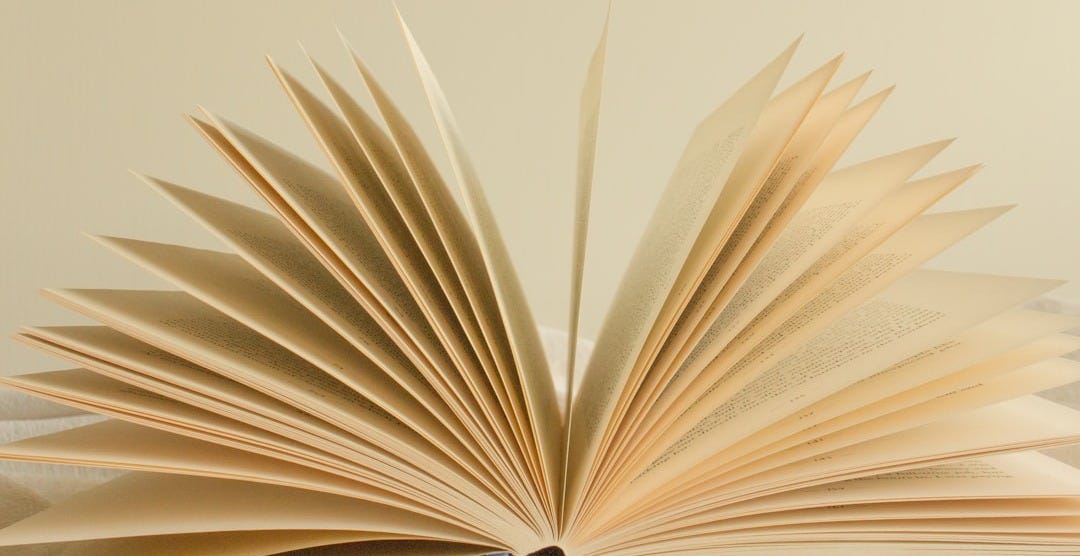white book page with black background