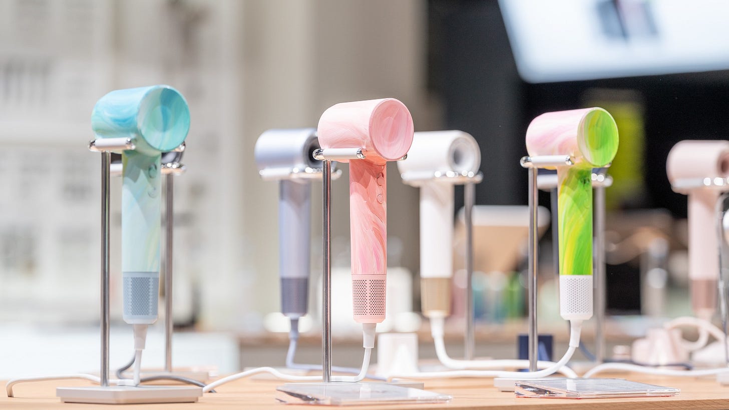 May be an image of hair dryer, phone and text