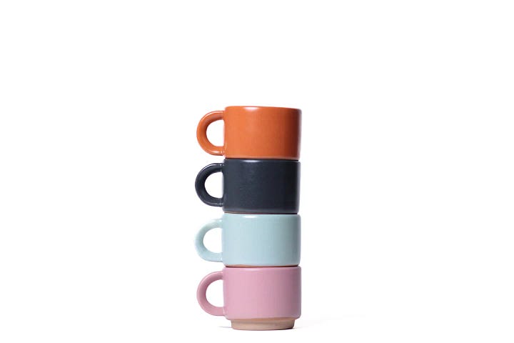 Photo One: multicolored stacking mugs.  Photo Two: a necklace with handmade fruit beads.