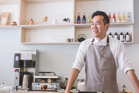 Frank Hsu of Frank's Coffee - behind the coffee machine at Frank's Coffee The Terrace.