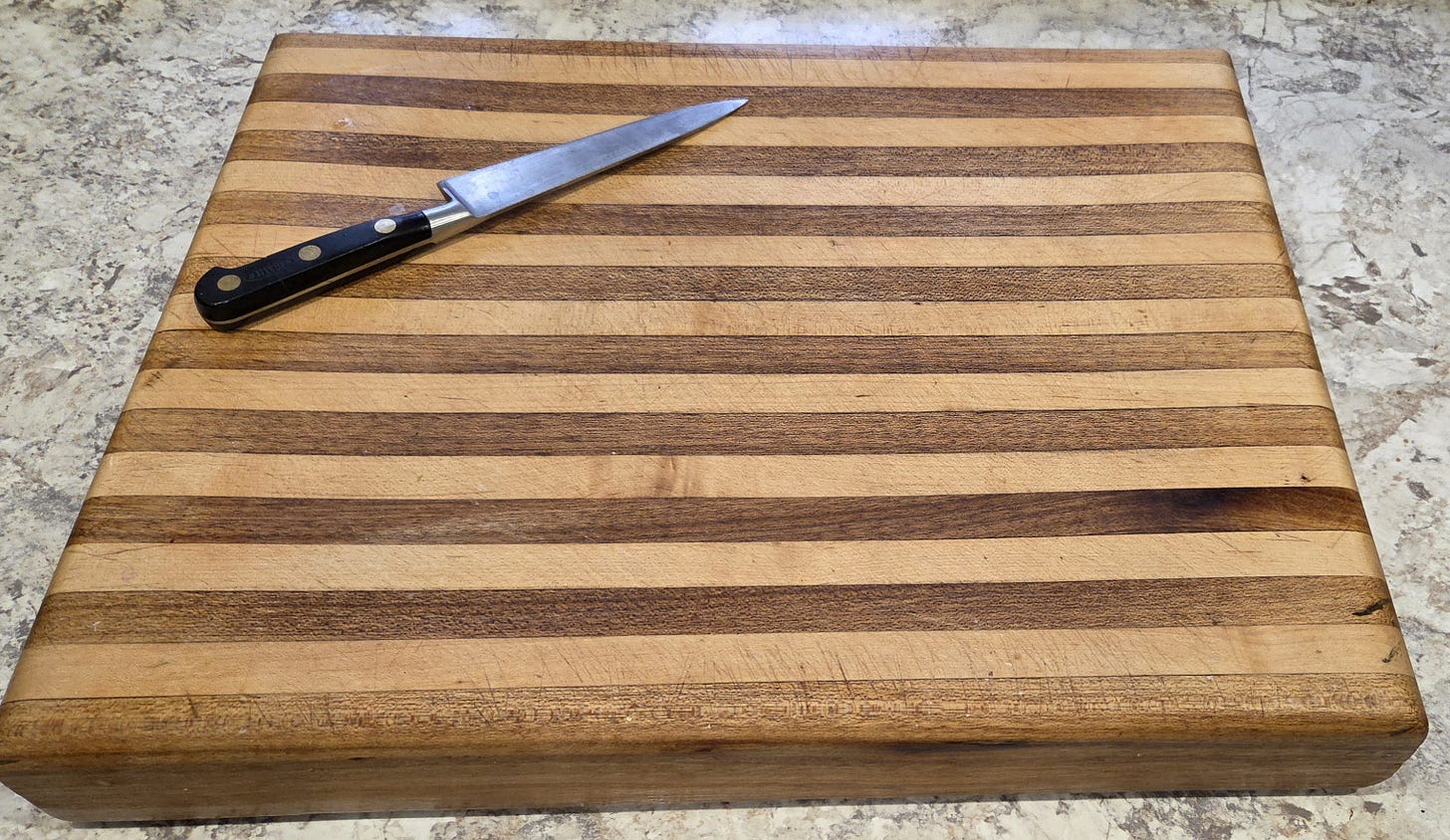 handmade cutting board with knife