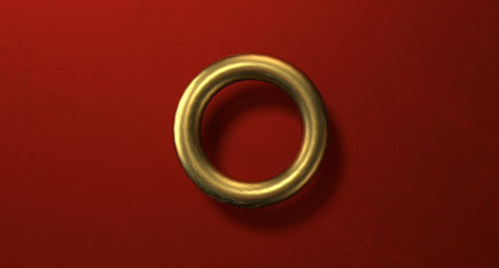 The photo of a golden ring on a red background The photo of a golden ring on a red background