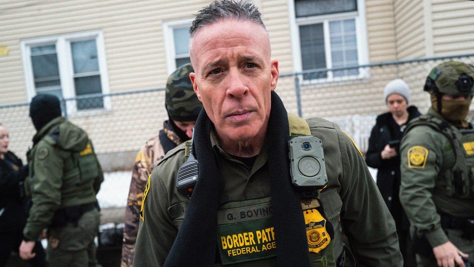 Greg Bovino stares ahead, unsmiling