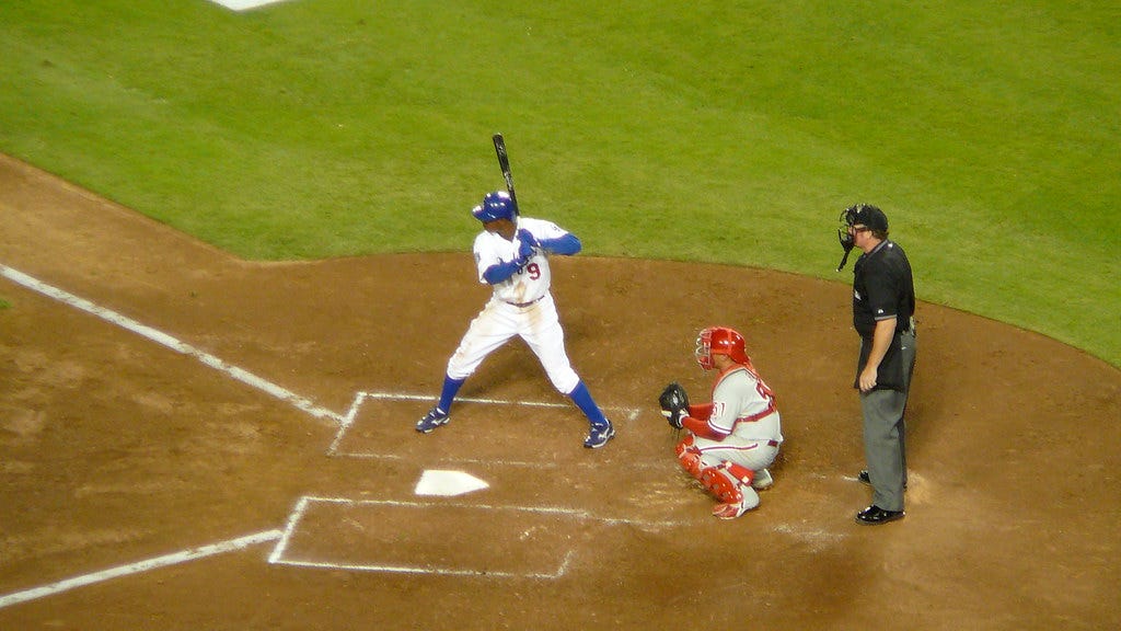 Juan Pierre, Carlos Ruiz, and Umpire Juan Pierre, Carlos Ruiz, and Umpire