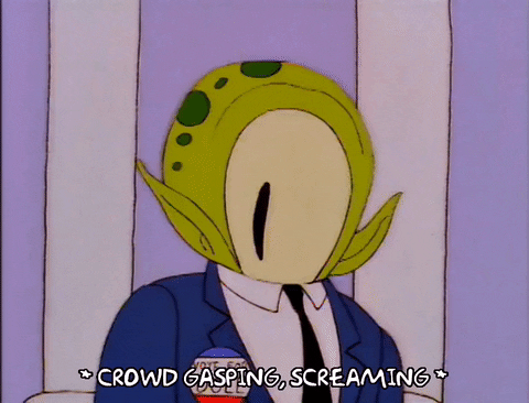 Animated GIF from The Simpsons of two aliens hiding in suits at a political debate - the crowd is shocked. Animated GIF from The Simpsons of two aliens hiding in suits at a political debate - the crowd is shocked.