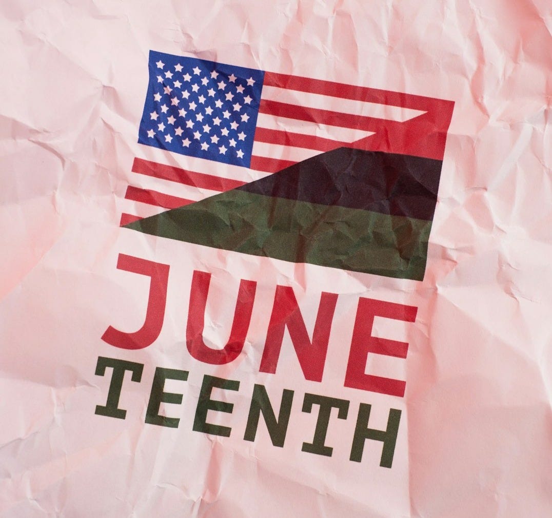 Juneteenth text with american and pan-african flags on crumpled paper. Juneteenth text with american and pan-african flags on crumpled paper.