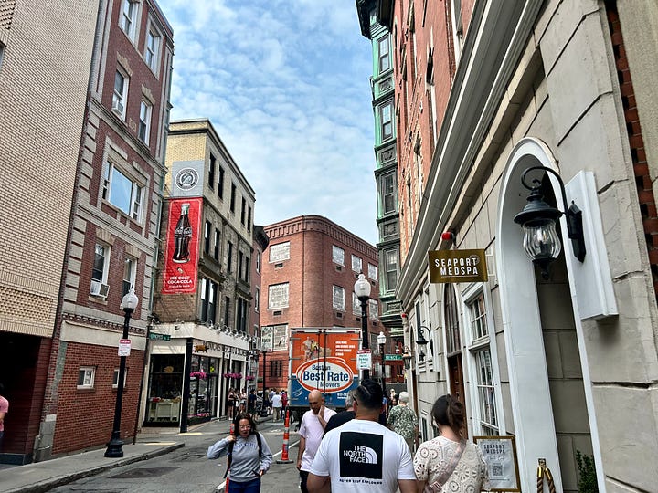 buildings, streets, signs, people