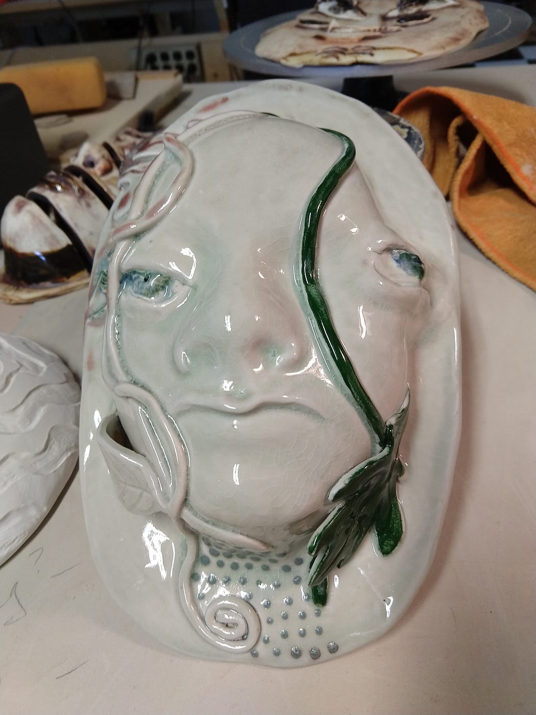 abstract porcelain mask with a distorted face similar to Picasso’s cubism distortions