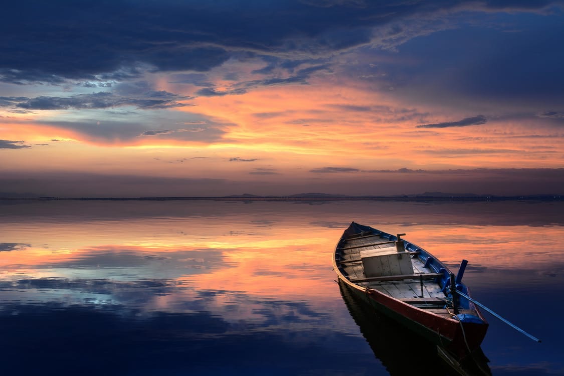 Free Photo of Wooden Boat on Sea Stock Photo