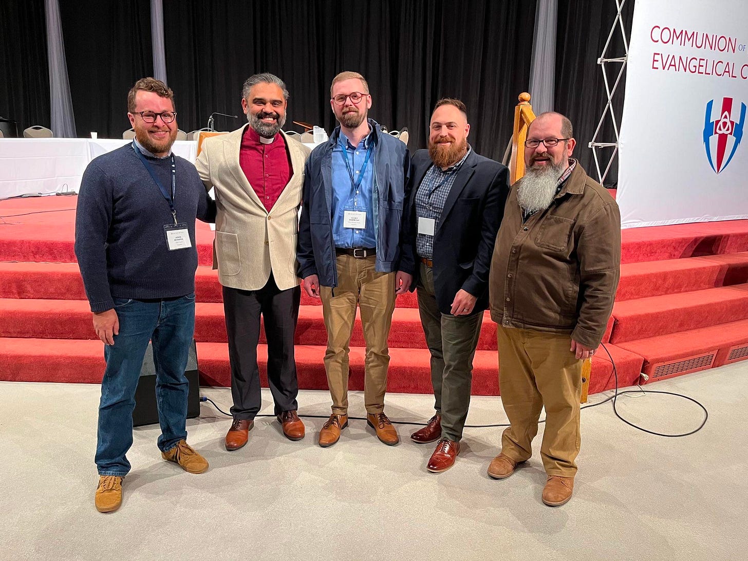 May be an image of 5 people and text that says 'COMMUNION EVANGELICAL ക'