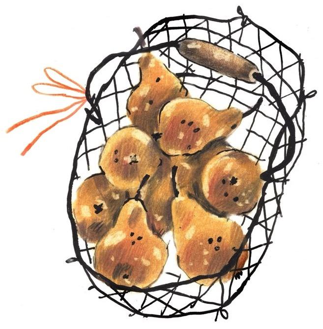 This may contain: a wire basket filled with pears on top of a white surface