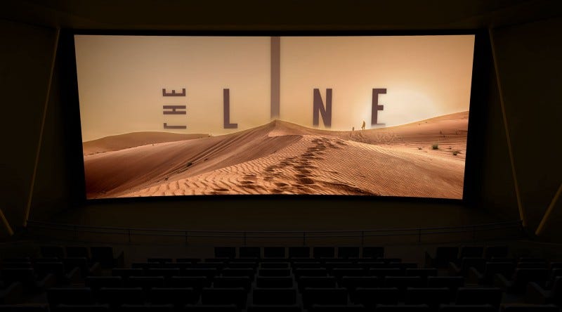 A darkened cinema with a screen showing the opening credits for a movie called The Line. A desert dune with the movie title emerging from behind. A darkened cinema with a screen showing the opening credits for a movie called The Line. A desert dune with the movie title emerging from behind.