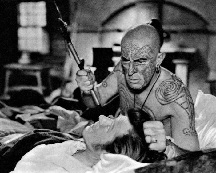 Ishmael and Queequeg, perhaps the originators of the “there was only one bed” trope (source)