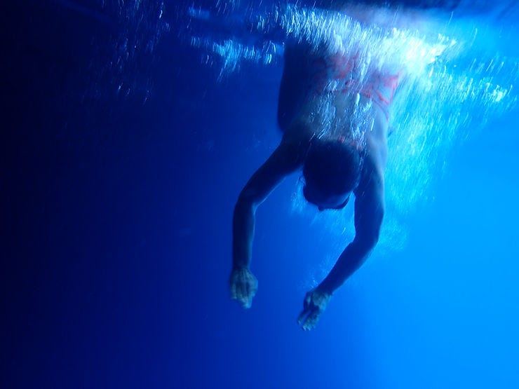 A woman diving into water