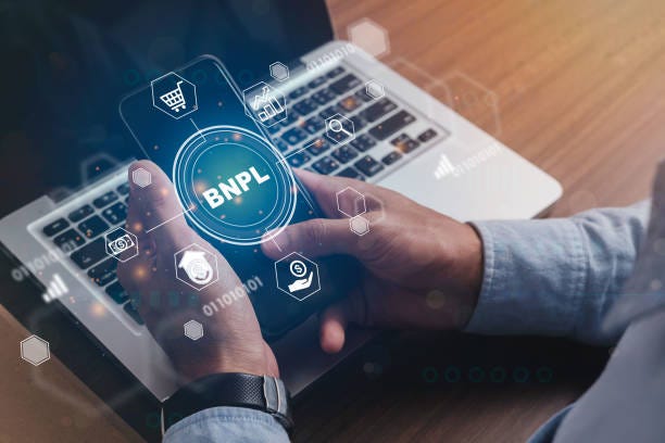 Businessmen holding a smartphone with icons of  BNPL with online shopping icons technology. BNPL Buy now pay later online shopping concept. Businessmen holding a smartphone with icons of  BNPL with online shopping icons technology. BNPL Buy now pay later online shopping concept. buy now pay later stock pictures, royalty-free photos & images