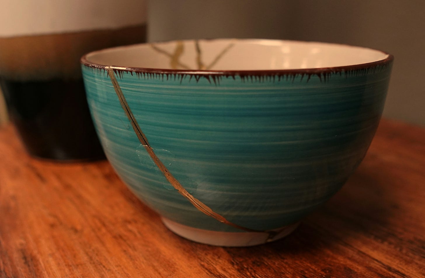 Blue pottery bowl. Cracks repaired with gold.