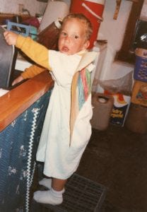 Peter age 2 rinsing dishes