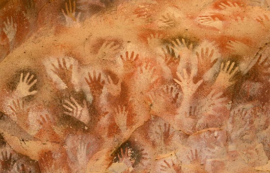 Neolithic handprints on cave wall