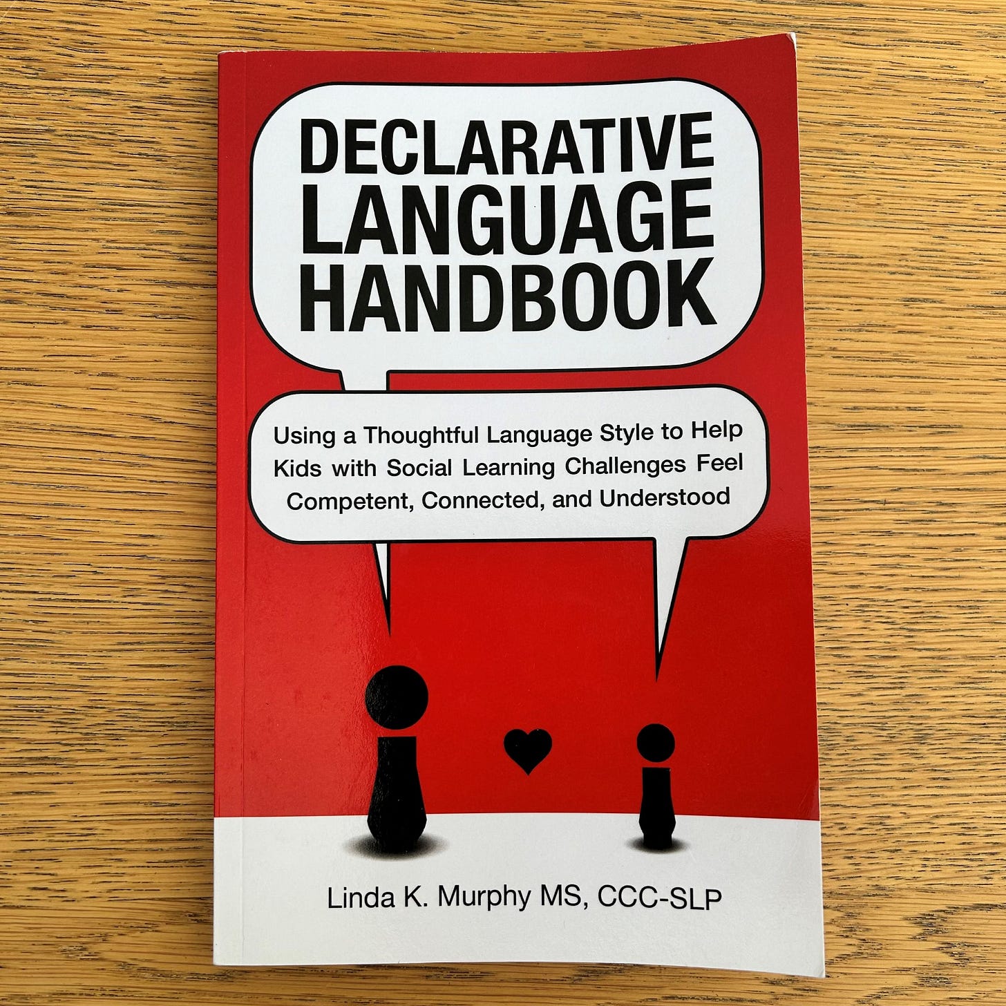 red cover with black text declarative language handbook