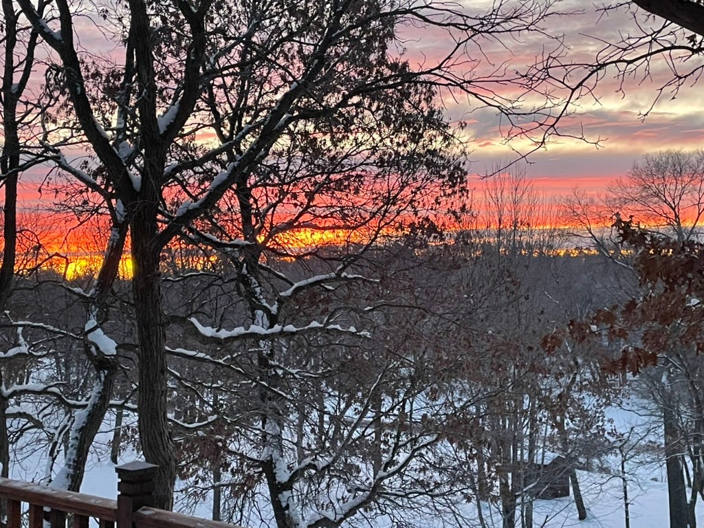 A snowy landscape with trees and a sunset

AI-generated content may be incorrect.