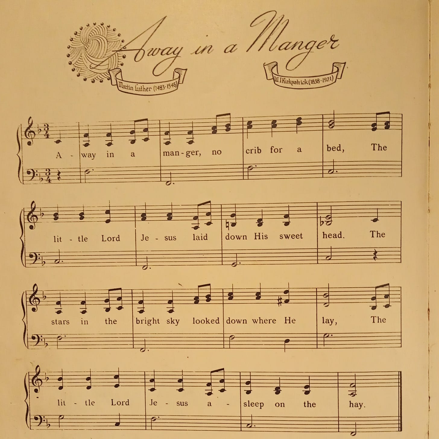 The first verse of Away in a Manger with music