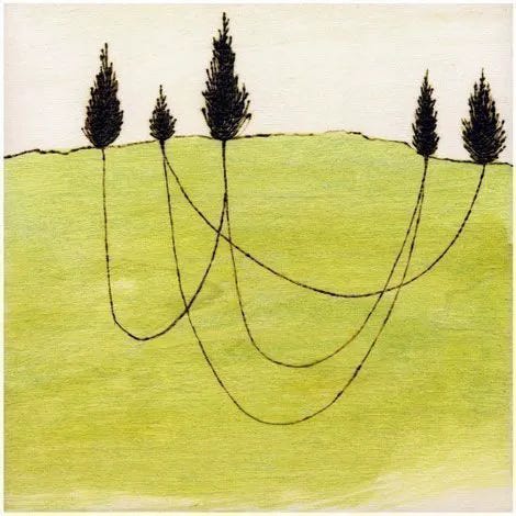 This may contain: three black trees on a green hill