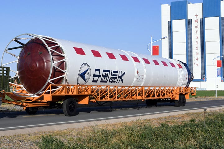 The first-stage and fairing for the Long March 2D Y92 vehicle heading to the launch pad.