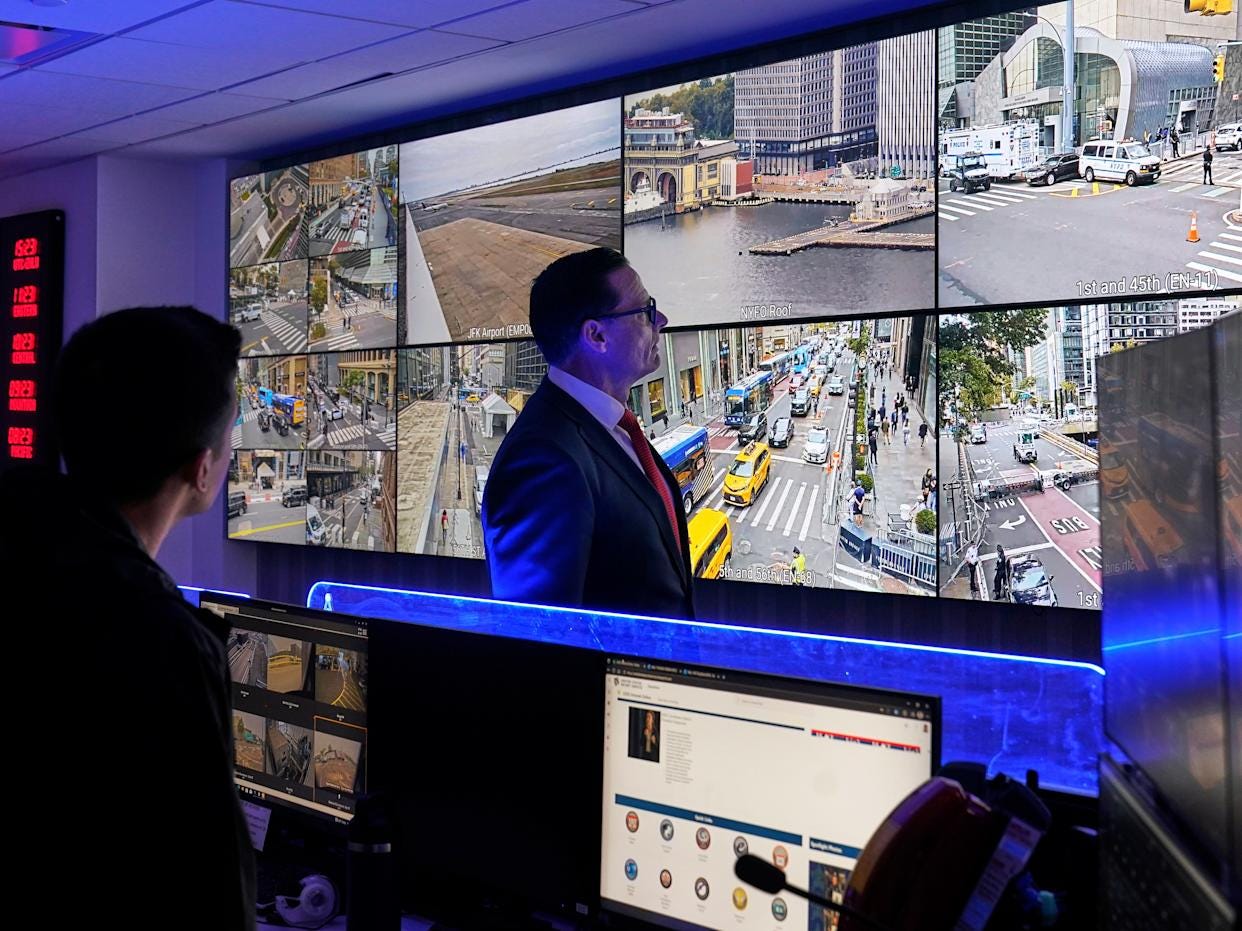 U.S. Secret Service Special Agent in Charge Matt McCool, center, looks at live video surveillance feeds in the agency's New York Field Office, in the Brooklyn borough of New York, Monday, Sept. 22, 2025. (AP Photo/Richard Drew)