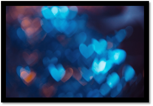 Little blue heart with a dark background