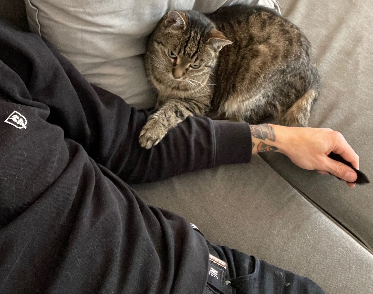 Chris kuddling with his cat Harry