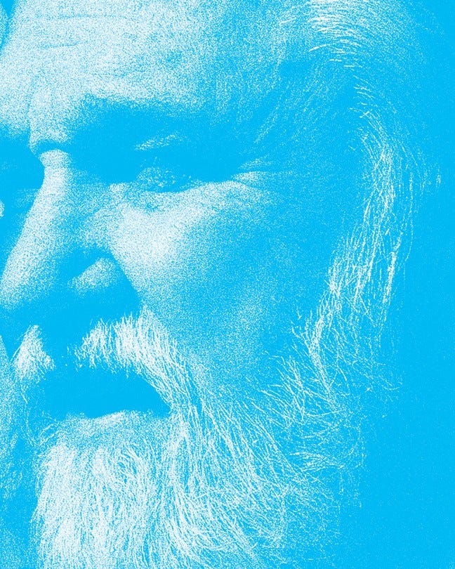 cropped profile detail of man's face with white hair and beard styled as blue duotone