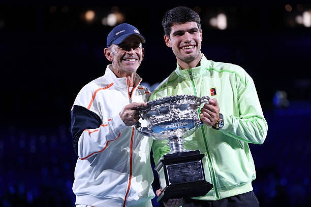 Spain's Carlos Alcaraz celebrates with his coach Samuel Lopez after defeating Serbia's Novak Djokovic in the men's singles final on Day 15 of the... Spain's Carlos Alcaraz celebrates with his coach Samuel Lopez after defeating Serbia's Novak Djokovic in the men's singles final on Day 15 of the...