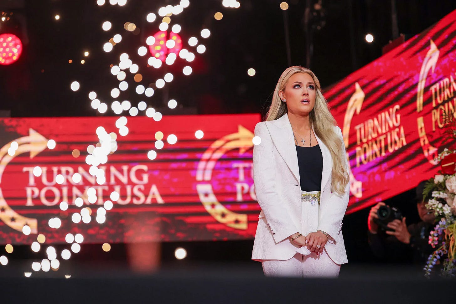 Erika Kirk appears onstage during the memorial service for her husband, conservative activist Charlie Kirk. Erika Kirk appears onstage during the memorial service for her husband, conservative activist Charlie Kirk.