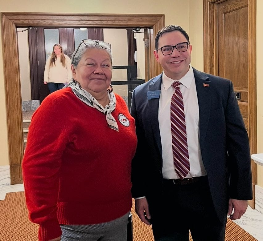 A woman and man in the Capitol hallway. A woman and man in the Capitol hallway.