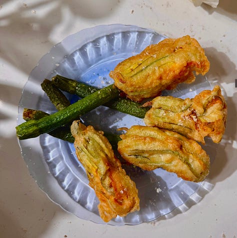 Collage of 7 easy summer appetizer recipes including golden fried zucchini blossoms, crispy eggplant rounds, loaded smashed potatoes, corn rangoons, panko-crusted goat cheese balls, pea fritters, and olive crostini - all ready in 30 minutes or less