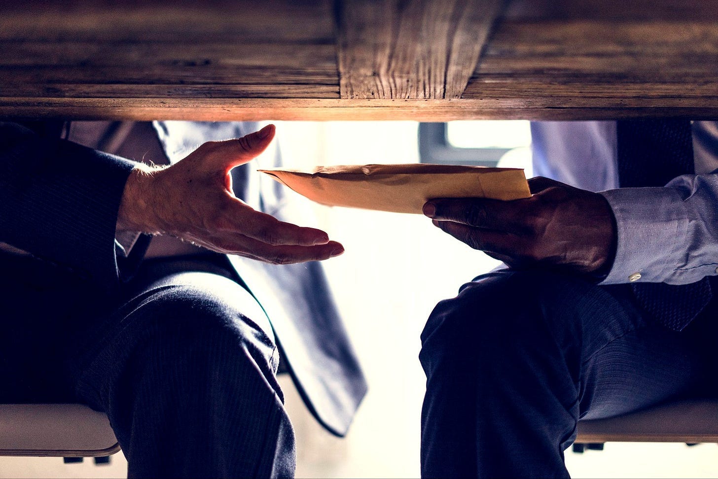 If city council members’ livelihoods depend on re-election, does that incentivize them to be even more susceptible to influence by special interests that can help them keep their lucrative jobs and accrue more benefits, not to mention the political powers of their office?(Image source: Oakland Report / Adobe Stock)