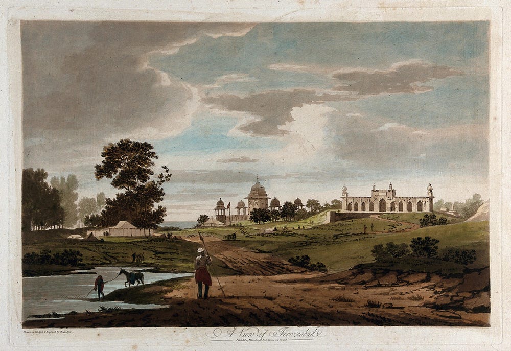 A coloured etching of an Indian countryside, with lovely architecture in the background and a large overcast sky. In the foreground, bare, muddy tracts stretch into gentle green slopes with scraggly bushes.