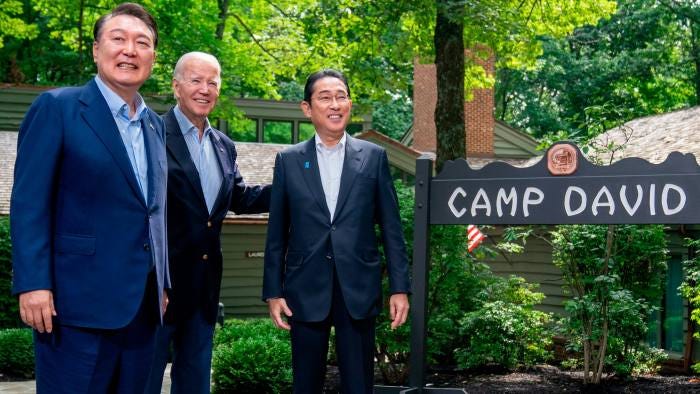 Joe Biden greets Yoon Suk Yeol of South Korea, left, and Fumio Kishida of Japan, right, at Camp David Joe Biden greets Yoon Suk Yeol of South Korea, left, and Fumio Kishida of Japan, right, at Camp David
