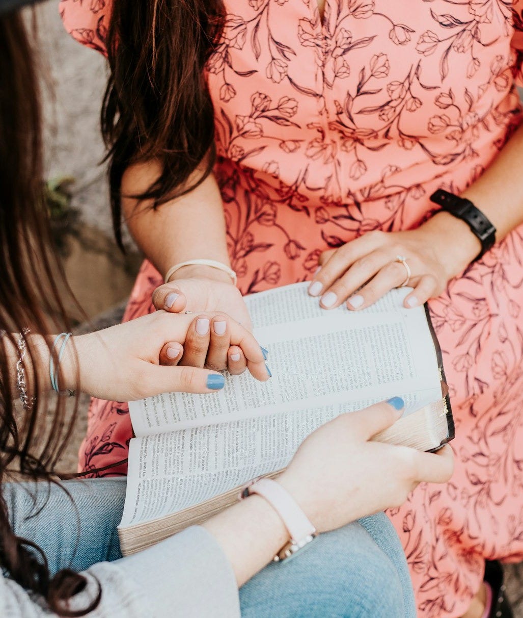 woman in red floral dress reading book woman in red floral dress reading book