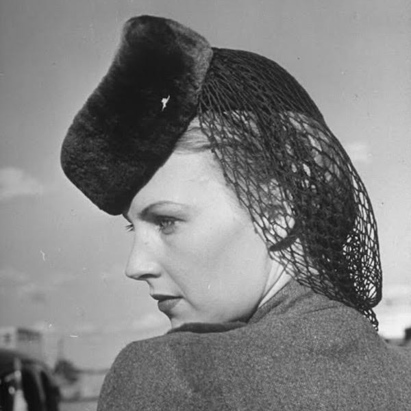 Model wearing sheared beaver hat featuring a wool snood, for sale at Neiman Marcus store, by Alfred Eisenstaedt, LIFE, 1939 Model wearing sheared beaver hat featuring a wool snood, for sale at Neiman Marcus store, by Alfred Eisenstaedt, LIFE, 1939