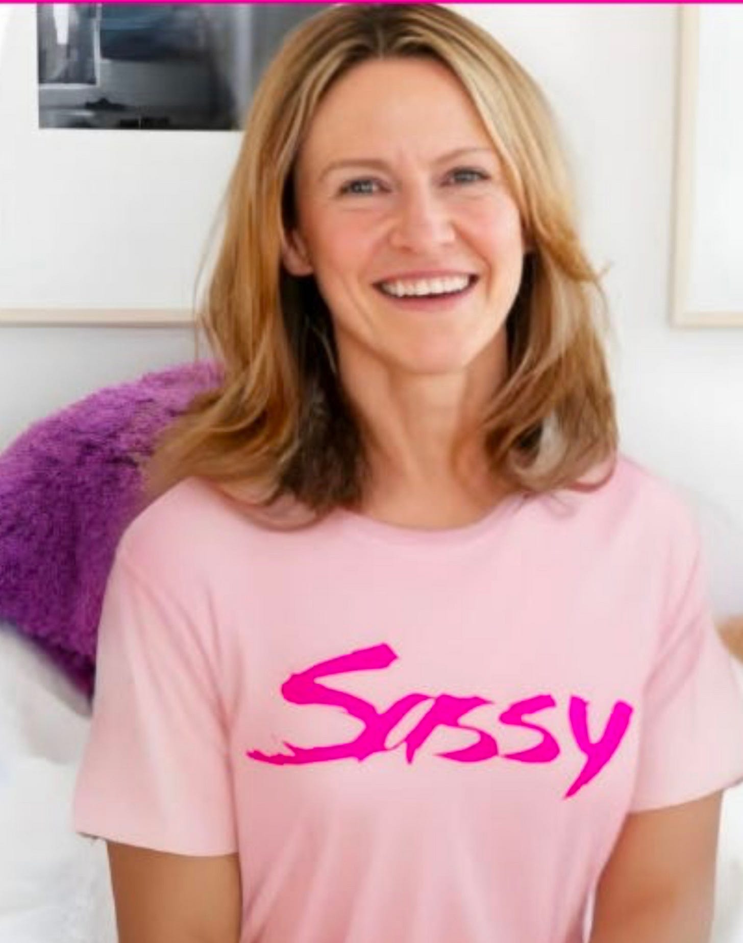 Jane Pratt wearing pink Sassy t shirt
