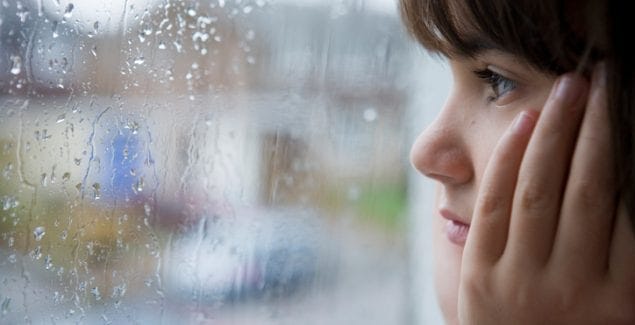 kid watching rain