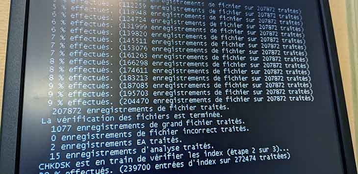 Photo of a PC display showing CHKDSK running.