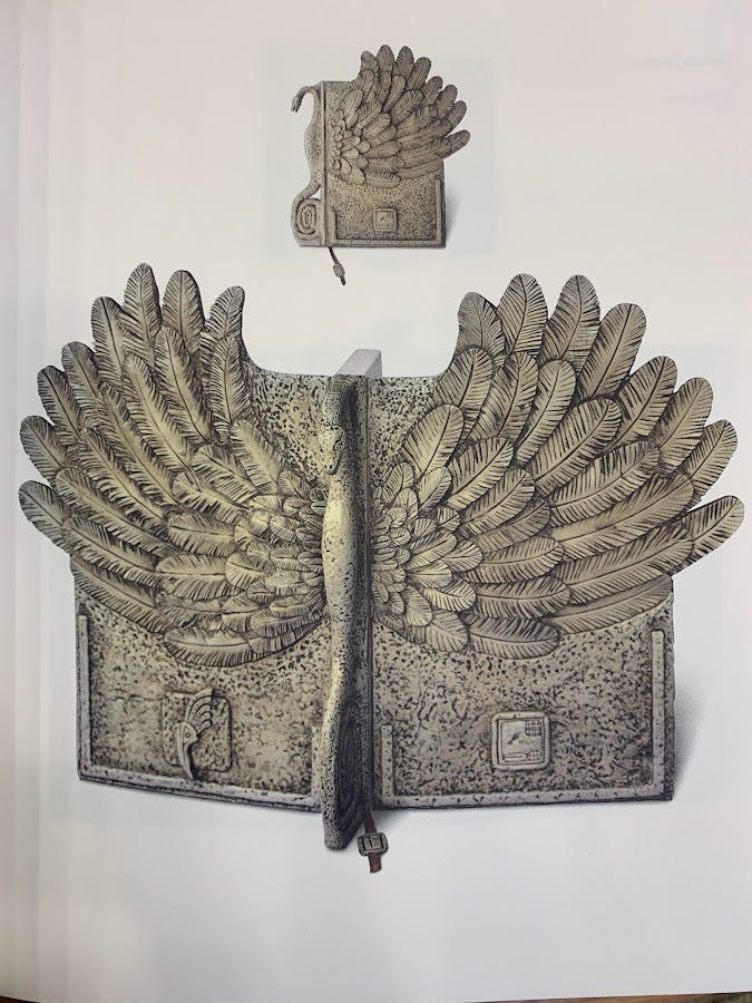Binding with phoenix as spine and outstretched feathered wings as boards