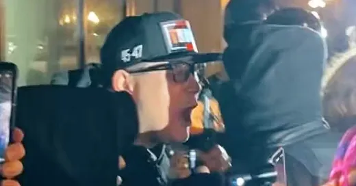 Protest streamer still with Portland skyline