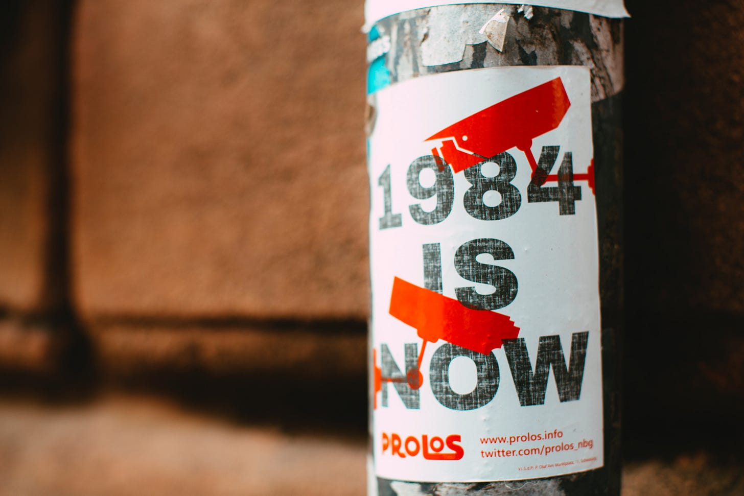 Sticker affixed to poll stating "1984 is now" Sticker affixed to poll stating "1984 is now"
