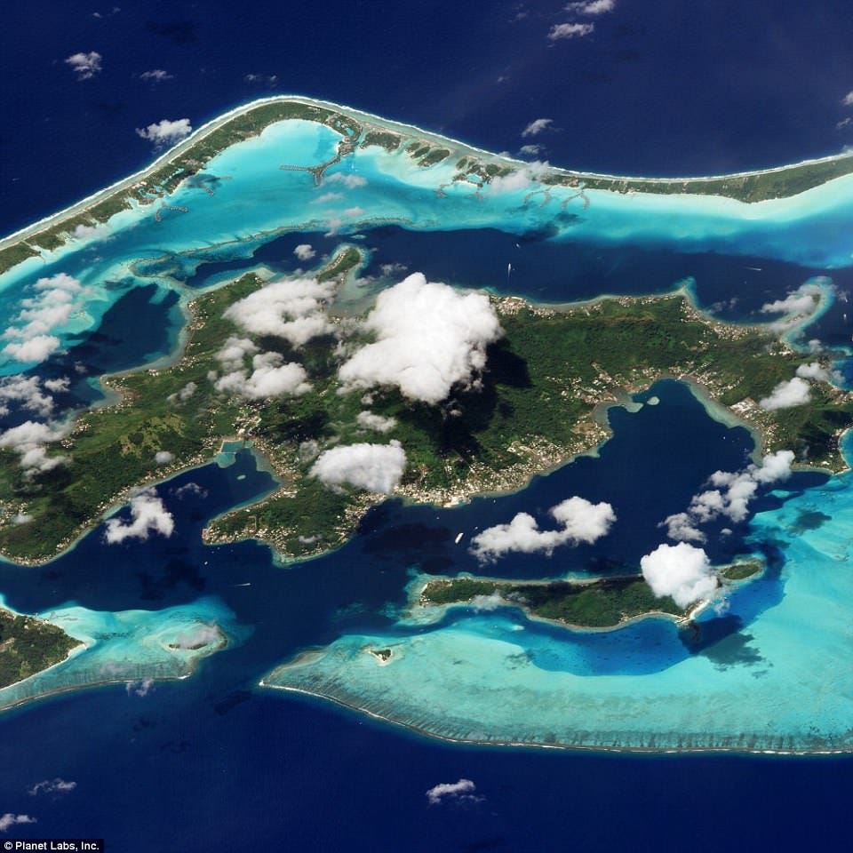 A number of the planet's natural wonders were also captured by Planet Labs's angled cameras, including Bora Bora - a volcanic island surrounded by fringing reefs in the South Pacific. The centre of the island houses an extinct volcano rising to two peaks, Mount Pahia and Mount Otemanu, with the highest point reaching 2,385 feet (727 metres) A number of the planet's natural wonders were also captured by Planet Labs's angled cameras, including Bora Bora - a volcanic island surrounded by fringing reefs in the South Pacific. The centre of the island houses an extinct volcano rising to two peaks, Mount Pahia and Mount Otemanu, with the highest point reaching 2,385 feet (727 metres)