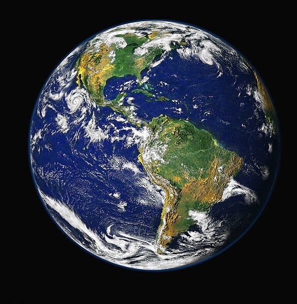 A planet earth with clouds and blue sky

Description automatically generated