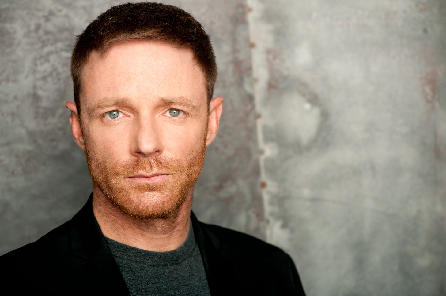 A man looks into the camera